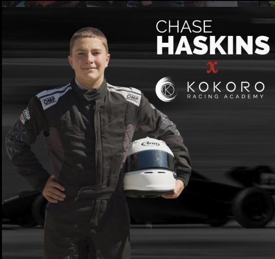 Chase Haskins in his race suit holding his helmet, Kokoro Racing Academy